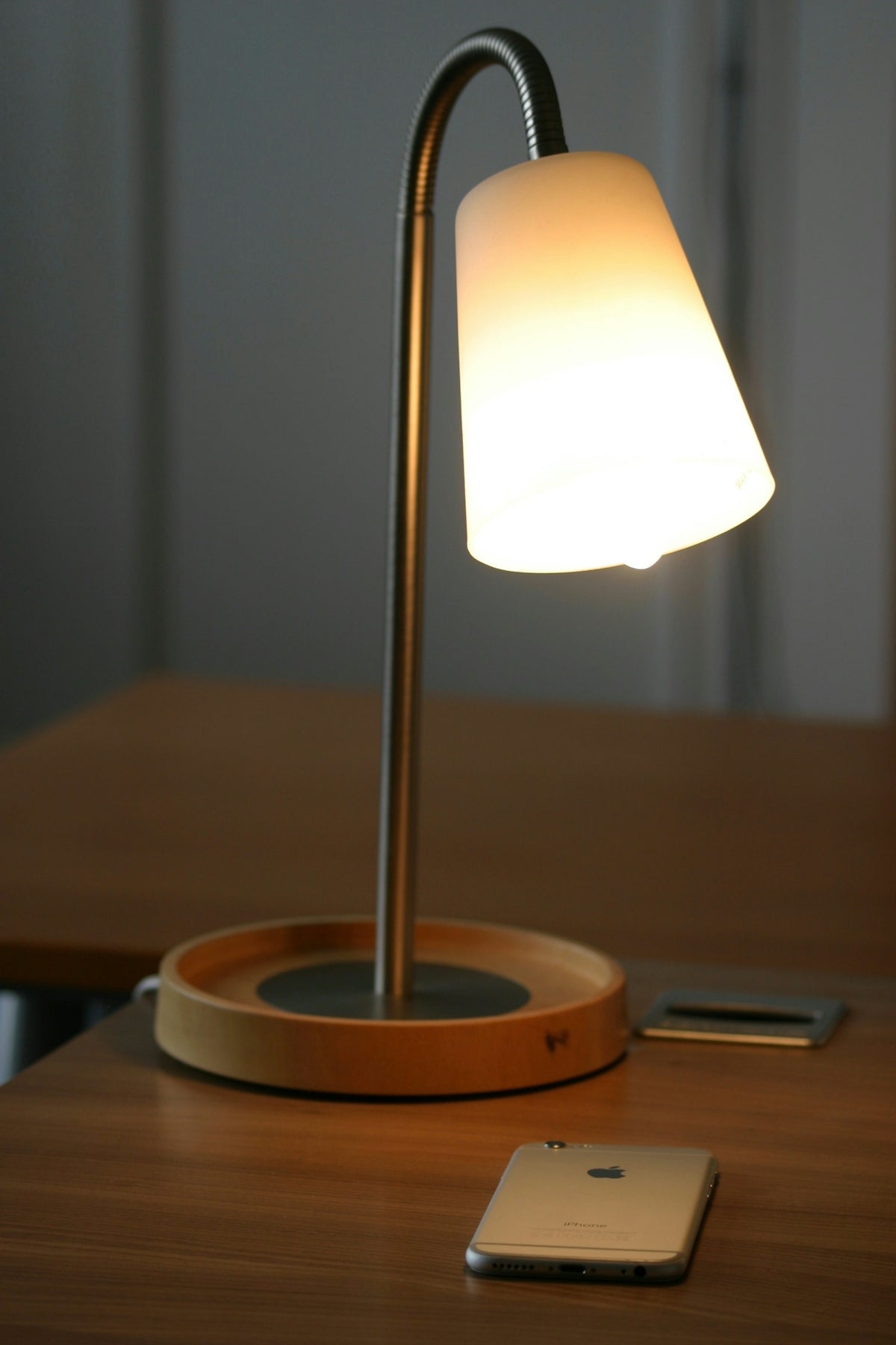 a table lamp sitting on top of a wooden table