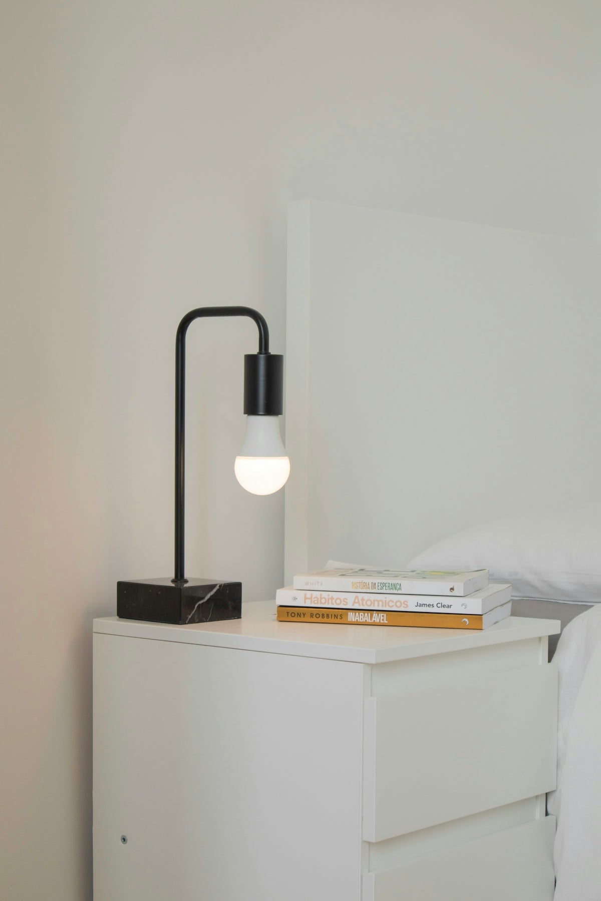 white and black desk lamp on white wooden table
