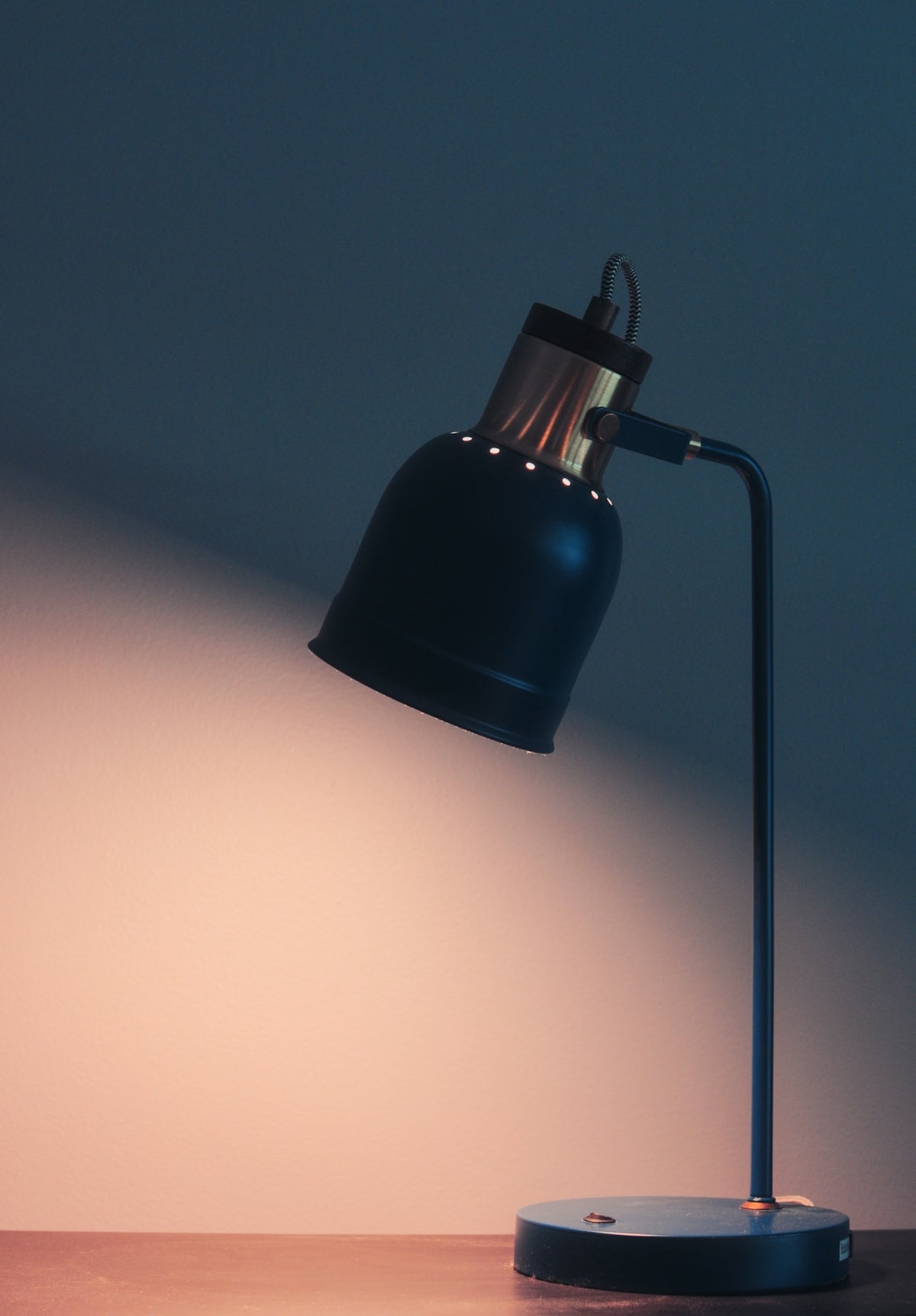 a black lamp on a table in a room